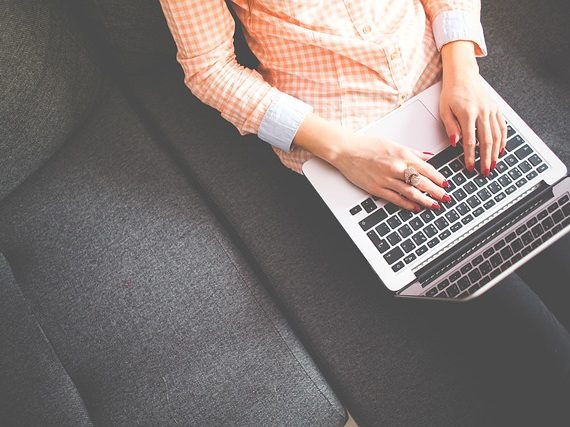 woman typing a title tags